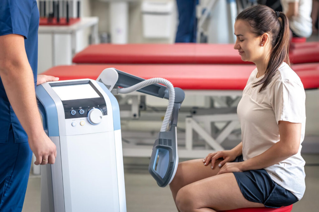 Patient receiving leg therapy from medical device
